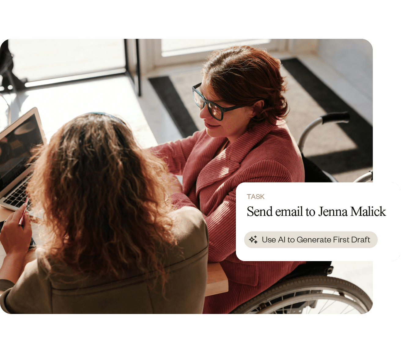 Two women using a laptop together.
